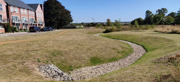 Houses overlooking gravel swales